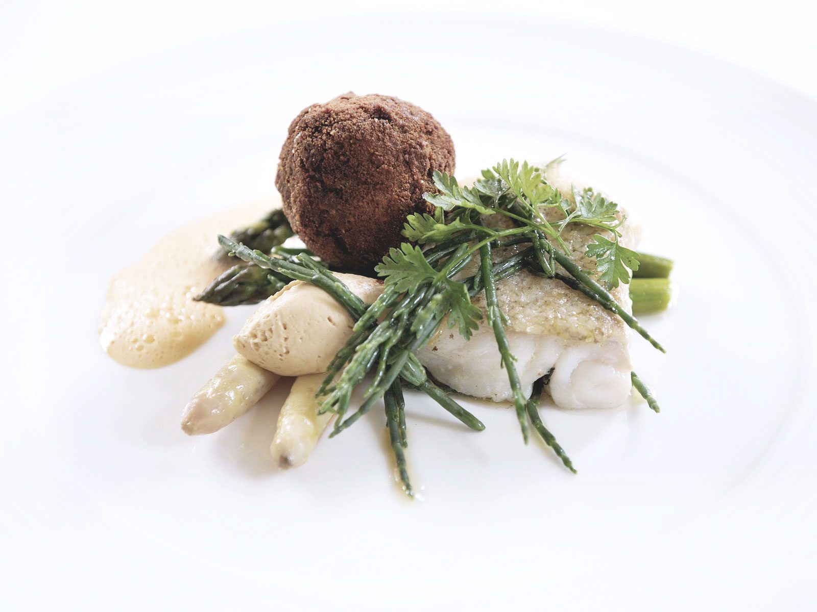 Sea Bass on bed of spinach and cream sauce Cafe Mineiro Brazilian